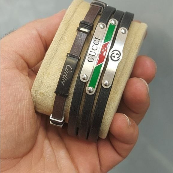 دستبند چرمی قفل و پلاک استیل مردانه طرح رولکس Rolex کیفیت چرم عالی تنوع طرح رنگ ثابت کد bn (پس کرایه)